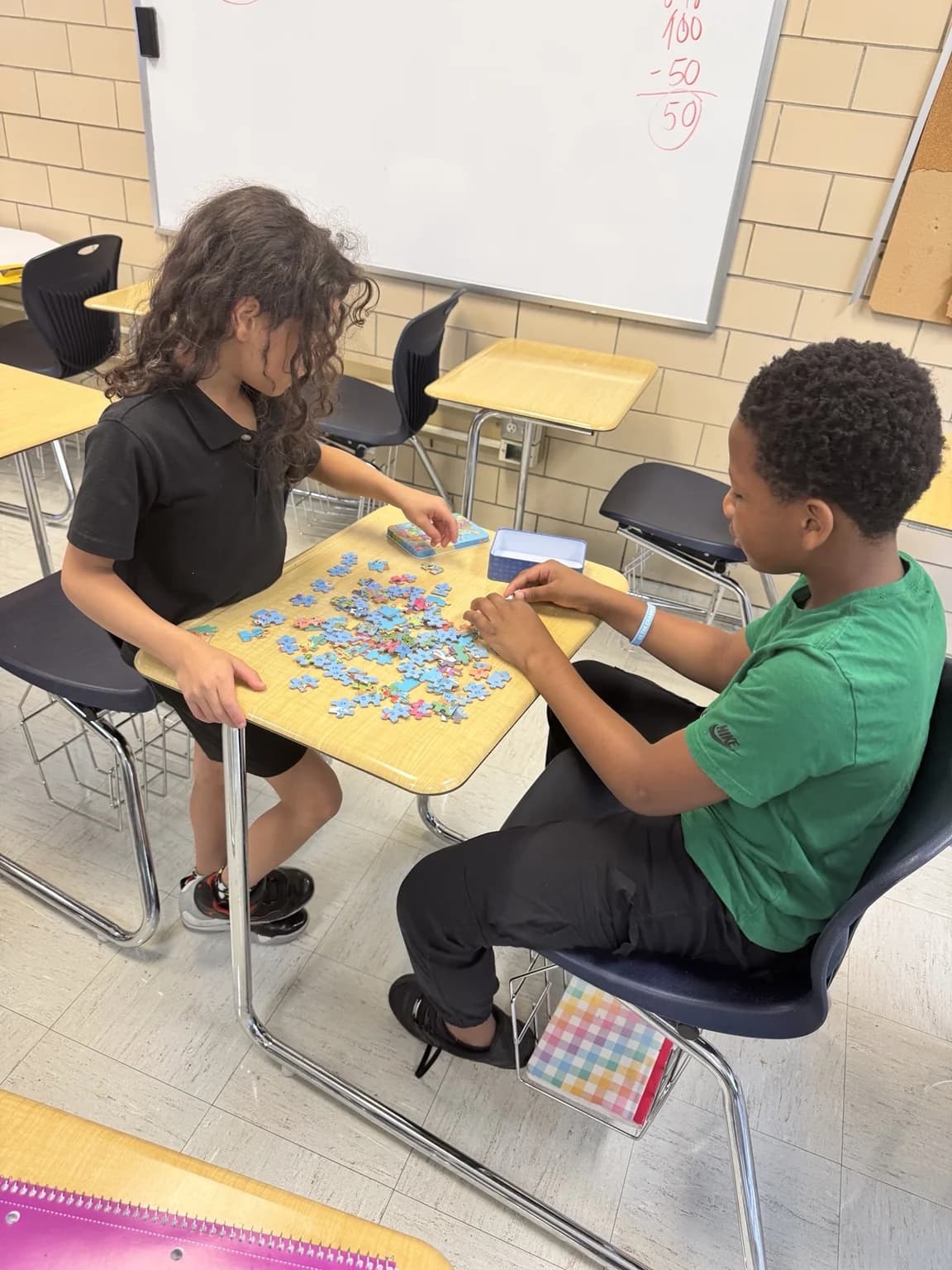 Students collaborating on a puzzle activity.