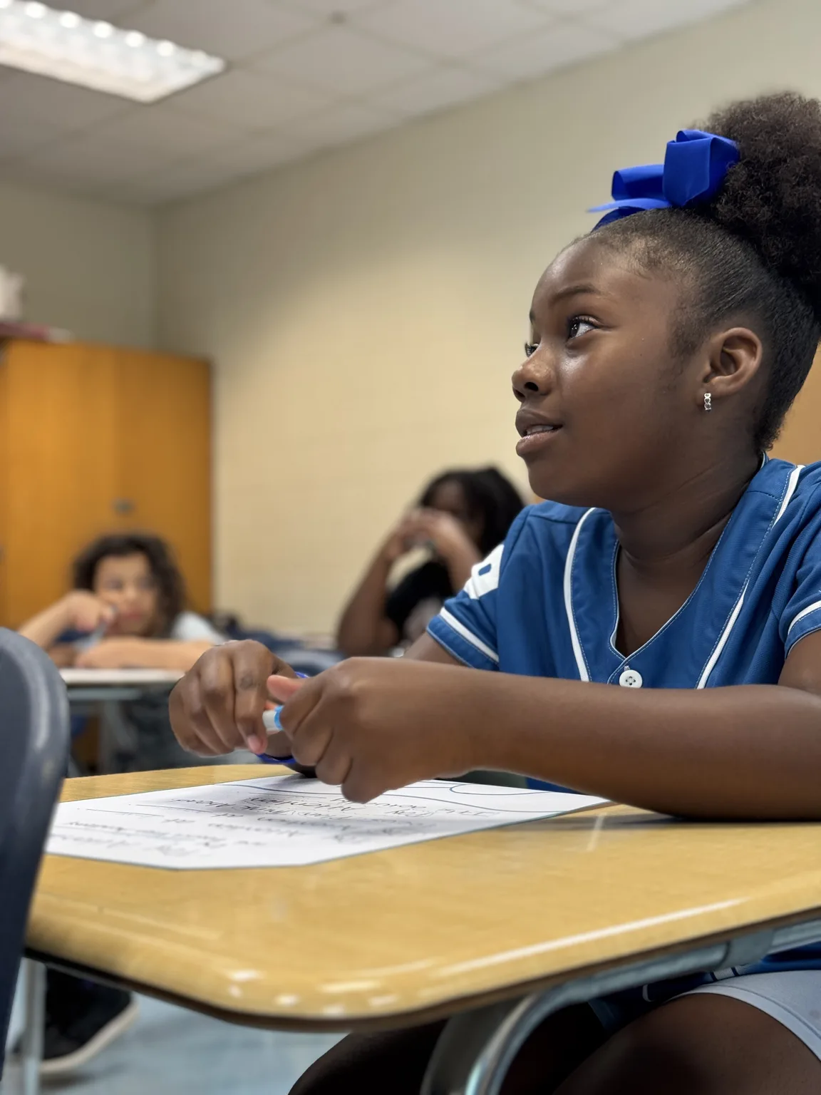 A student stays focused during a classroom activity.
